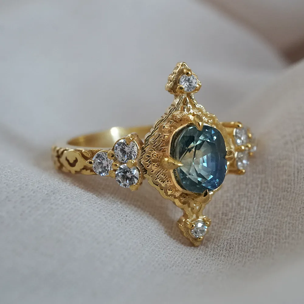 One Of A Kind: Arabasque Bi-Color Sapphire Ring in 14K and 18K Gold